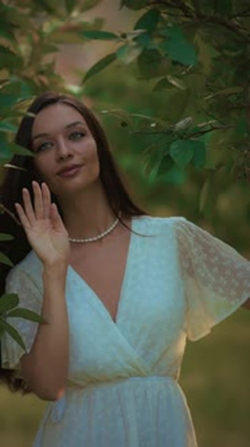 Young Woman Relaxing in a Green Park