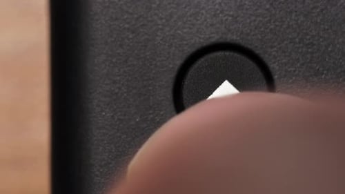 Finger Pressing Up Arrow Button