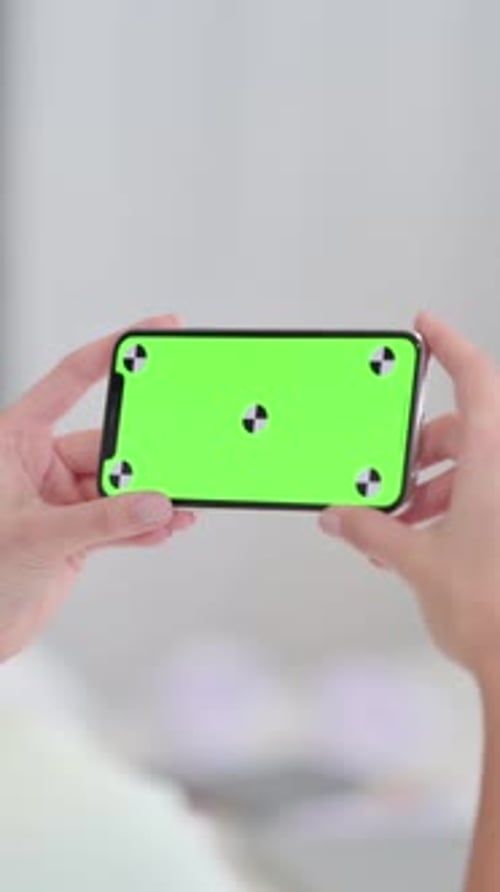 Holding Horizontal Smartphone with Green Chroma Key Screen, Vertical Video