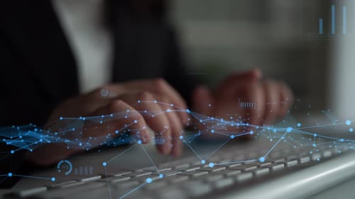 Business Professional Analyzing Data on Computer with Graphs and Diagrams in a Modern Office Setting