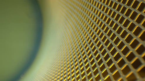 Moving down a curved metal grid. Focus starts far right and then moves to the center the closer it g