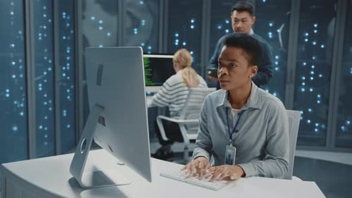 Data Center African IT Specialist Woman Using Computer Desktop Typing Keyboard Browsing Server