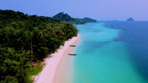 Koh Kradan Island Southern Thailand with Longtail Boats at the Beach and a Turqouse Colored Ocean