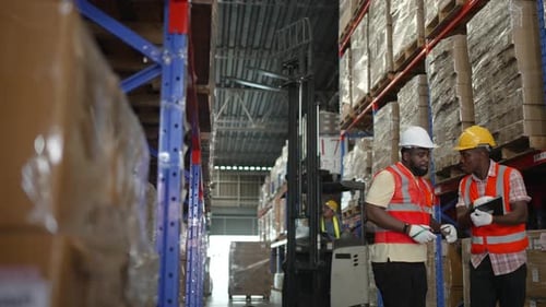 Logistics employees are working warehouse.