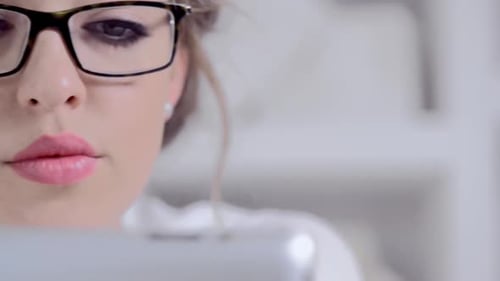 Attractive Woman Using Tablet Device Indoors