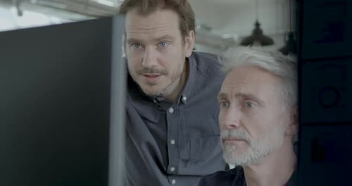 Two colleagues Meeting in Office around Computer PC