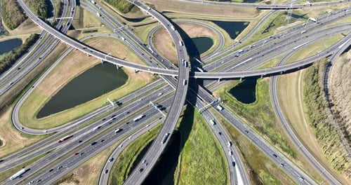 Modern urban infrastructure, road junction, and city transportation system from above.
