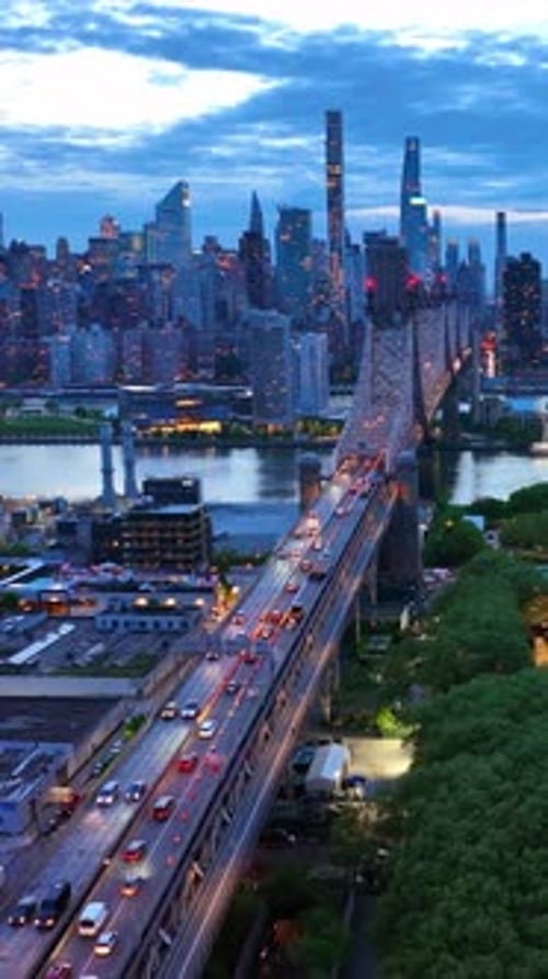 The 59th Street Bridge over East River in New York City. Beautiful scenery of evening metropolis