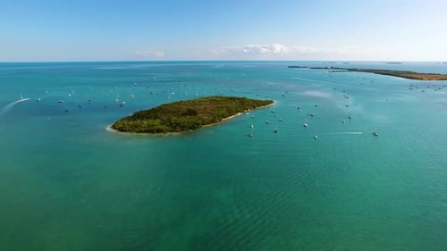 Sailboats Anchored Off Island Shore Aerial