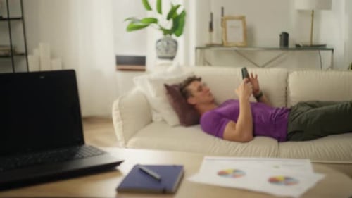 The Man Took a Break From Work and Lay Down on the Couch in His Home Office