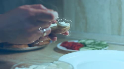 Spreading White Sauce on Bread in the Kitchen