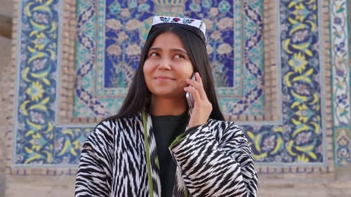 Smiling Woman Talking on Smartphone