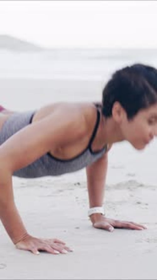 Fitness, push up and woman by beach for wellness, health or body training in morning for active