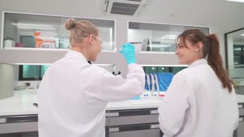 Scientists working in a clean, modern laboratory
