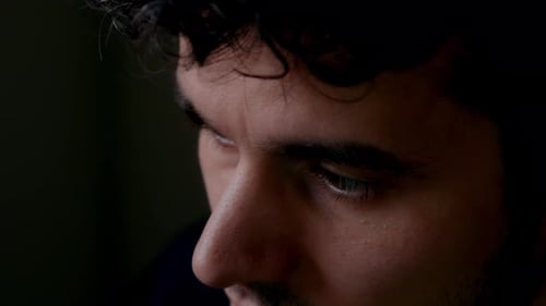 Extreme Close-Up of Focused Man’s Eyes While Working