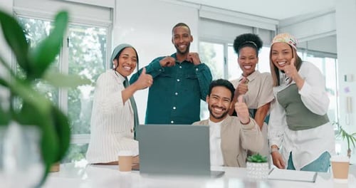 Thumbs up, community and teamwork with business people and laptop in office for strategy