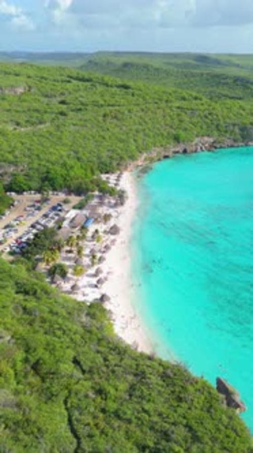 Vertical aerial of Cas Abao beach with vibrant tropical shoreline