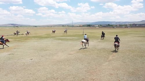 Horses And Men In Javelin Game With Aerial View
