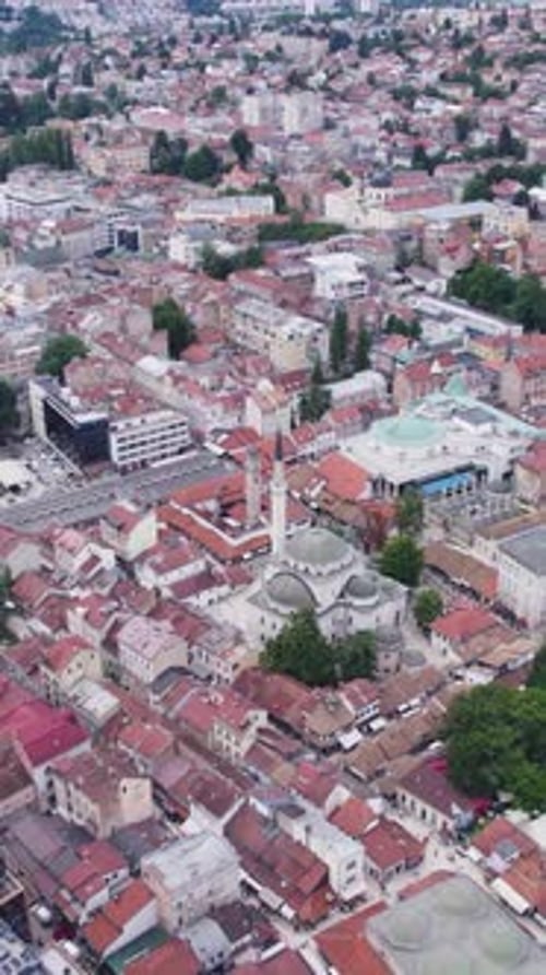 Aerial - Gazi Husrev-beg Mosque rising in Sarajevo old town skyline