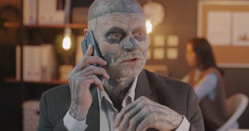 Zombie Man Talking on Phone in Office