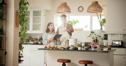 Couple Cooking Together in Bright Kitchen