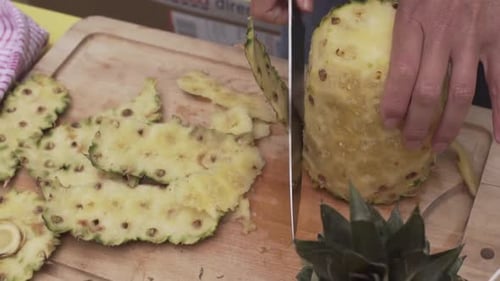 Preparing Fresh Pineapple on Cutting Board