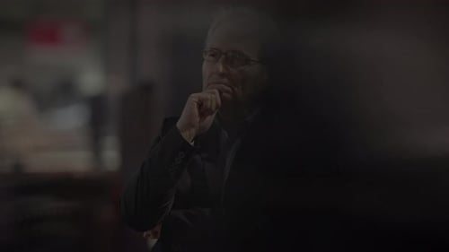 Pensive Businessman Thinking in Urban Setting at Night