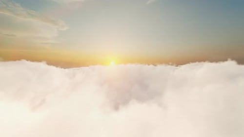 Flying Through Fluffy Clouds Towards Golden Sunset