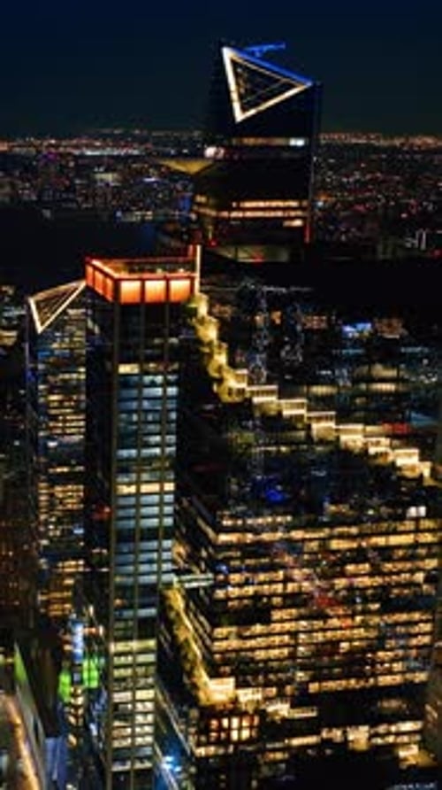 Rising above the splendid cityscape of New York. Night city view from drone footage.
