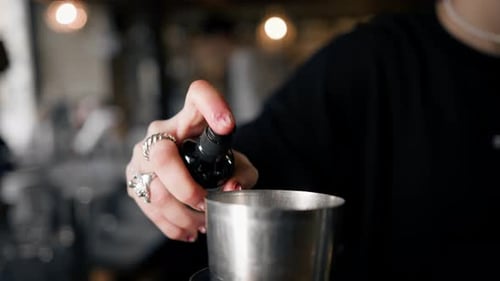 Close-up - the process of preparing a cocktail in a restaurant using a shaker