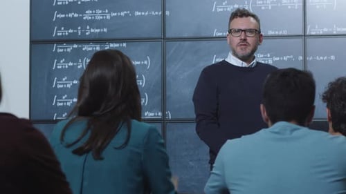 Professor Teaching Mathematics to Students in Classroom