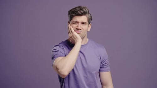 Mature Man Touching Cheek With Painful Expression Reacting To Sudden Toothache