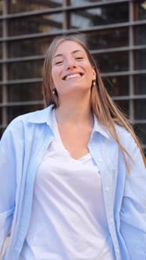 Happy Woman Smiles in an Urban Setting