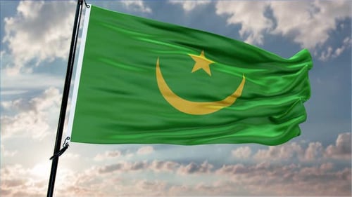 Green Flag Waving with Golden Crescent and Star Against Cloudy Sky