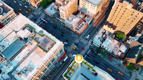Crossroads of the metropolis with lively traffic. Drone rising above the scenery of New York, USA.