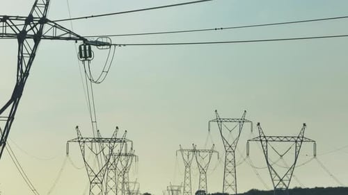 Electricity towers against clear sky