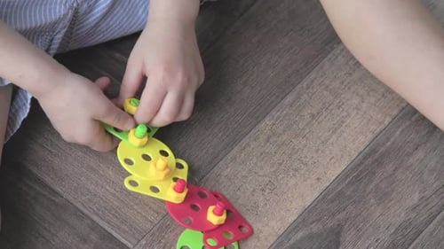 Engaging in Creative Play with Colorful Building Blocks is a Fantastic Activity for Kids