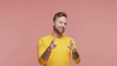 Expressive Young Man Over Vibrant Background Studio Portrait of Handsome Person