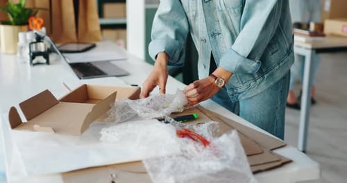 Hands, boxes and packaging for shipping at startup, warehouse and bubble wrap with safety