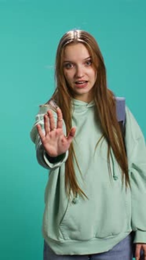 Vertical Video Assertive Young Woman Doing Stop Hand Gesture
