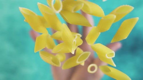 Penne Pasta Flying in the Air, Slow Motion