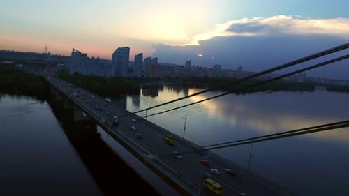 Bridge Traffic Over River at Sunset, Aerial View