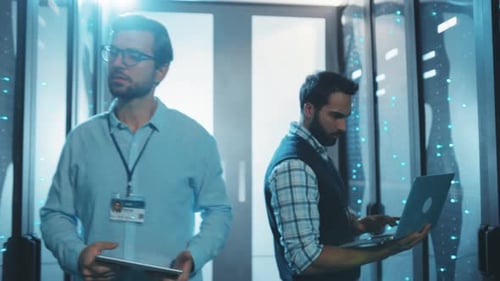 Two IT Engineers Working in a Server Room