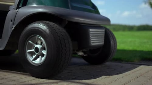 Professional Golfing Cart Wheels at Golf Club Road. Sport Buggy at Summer