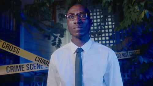 Adult Standing near Crime Scene Tape at Night