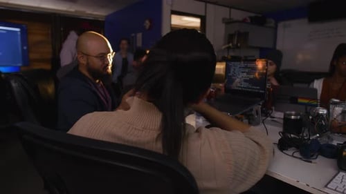 Hackers collaborate at hackathon with laptops and wireless technology