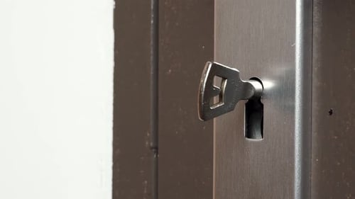 Key Hole In Wooden Door With Key