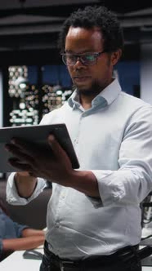 Vertical Video Programmer in Office Developing App Using Tablet Writing Code