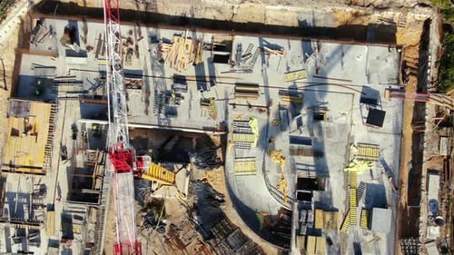 Aerial Flight Over a New Constructions Development Site with High Tower Cranes Building Real Estate.