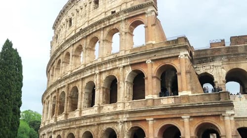Colosseum located in the ancient centre of Rome, Italy. People inside it